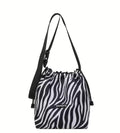 Bolso saco estampado cebra blanco y negro con asa regulable