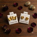 Pendientes relieve dorado stainless steel mariposa y corazón